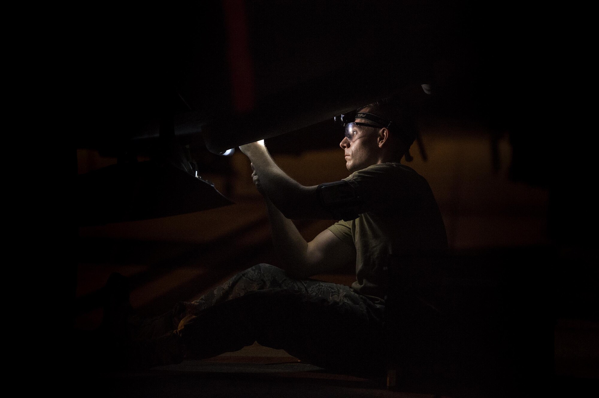 U.S. Air Force Senior Airman Daniel Cassidy, 723d Aircraft Maintenance Squadron electronic warfare journeyman, removes flares from an HC-130J Combat King II, Aug. 17, 2016, at Moody Air Force Base, Ga. During post and pre-flight inspections, electronic warfare specialists are responsible for ensuring moisture accumulated during flight doesn’t affect the large area infrared counter measure system. After the inspection is complete Airmen are able to remove flares but must cordon off the area and maintain a 25-foot circle of safety. (U.S. Air Force photo by Airman 1st Class Janiqua P. Robinson)  