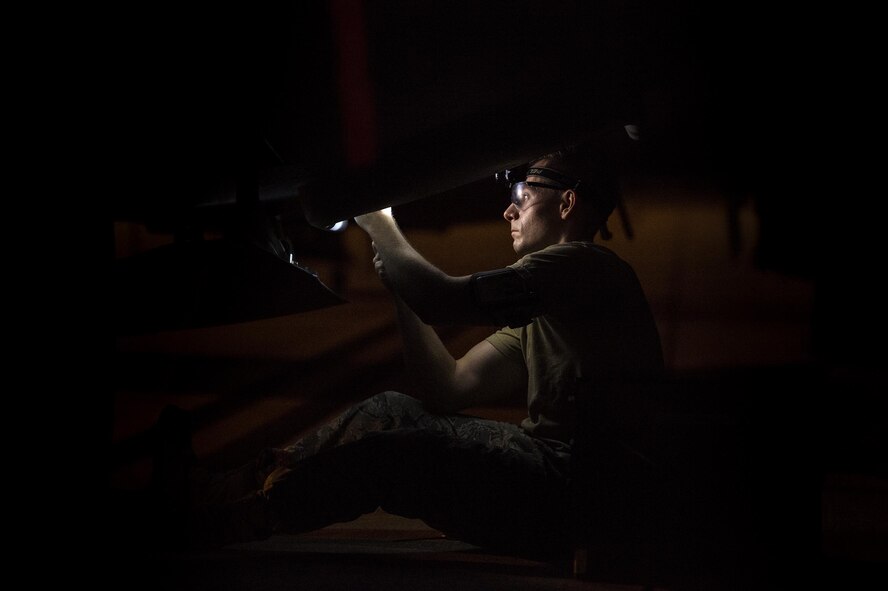 U.S. Air Force Senior Airman Daniel Cassidy, 723d Aircraft Maintenance Squadron electronic warfare journeyman, removes flares from an HC-130J Combat King II, Aug. 17, 2016, at Moody Air Force Base, Ga. During post and pre-flight inspections, electronic warfare specialists are responsible for ensuring moisture accumulated during flight doesn’t affect the large area infrared counter measure system. After the inspection is complete Airmen are able to remove flares but must cordon off the area and maintain a 25-foot circle of safety. (U.S. Air Force photo by Airman 1st Class Janiqua P. Robinson)  