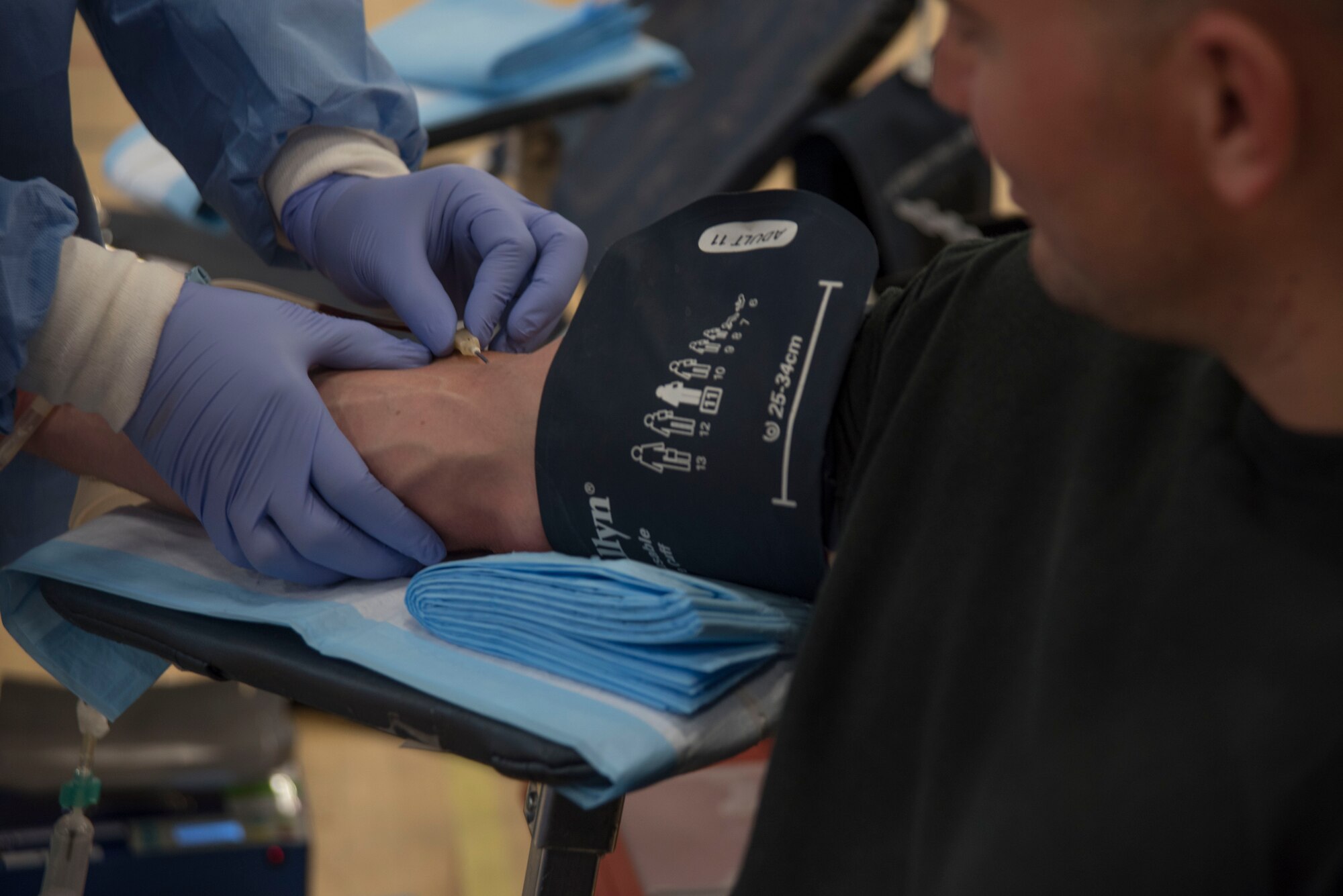 Antilnette Hunter, Walter Reed National Medical Center health technician, prepares to draw blood from Staff Sgt. Tim Rowland, 811th Security Force Squadron protective services supervisor, during a blood drive for the Armed Services Blood Program at the West Fitness Center on Joint Base Andrews, Md., Aug. 16, 2016. The ASBP collected blood donations that will be shipped into theater and to medical treatment facilities around the National Capital Region. 
