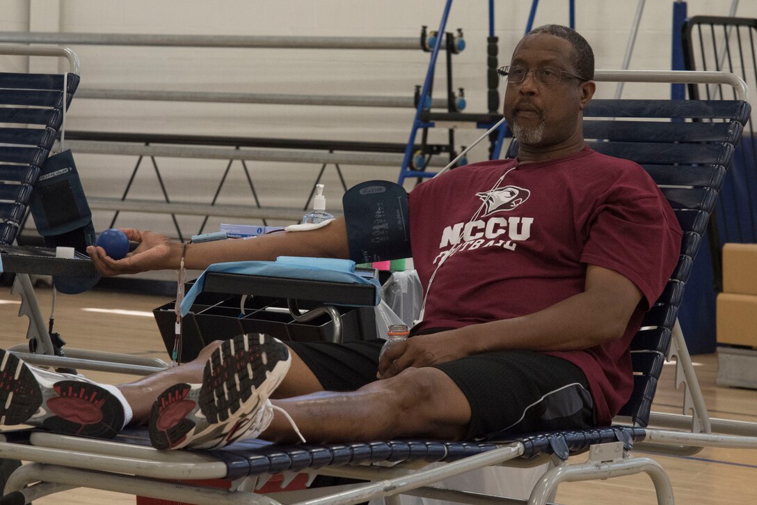Barry Brooks, retired Air Force Tech. Sgt., donates blood during a blood drive for the Armed Services Blood Program at the West Fitness Center on Joint Base Andrews, Md., Aug. 16, 2016. The ASBP collected blood donations that will be shipped into theater and to medical treatment facilities around the National Capital Region. 