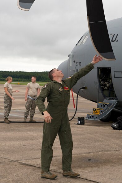 U.S. Air Force Reserve Maj. Scott Lawson, a C-130J pilot assigned to the 327th Airlift Squadron, conducts a walk around as part of a preflight inspection at Little Rock Air Force Base, Ark., Aug. 13, 2016. Airmen from the 913th Airlift Group passed a milestone when the first two-ship mission was flown during a Unit Assembly Training weekend for the first time since the Group transitioned from the “H” to the “J” model. (U.S. Air Force photo by Master Sgt. Jeff Walston)