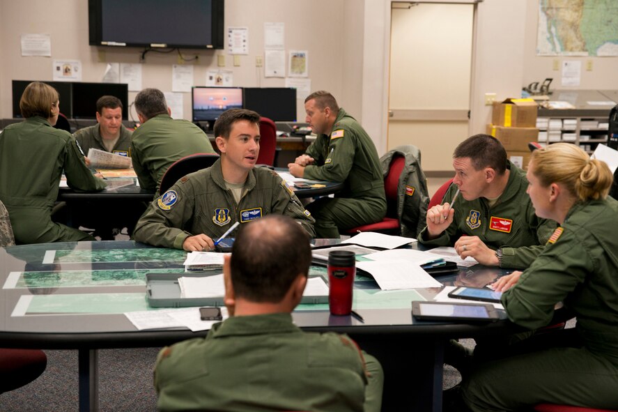 Airmen assigned to the 327th Airlift Squadron, 61st Airlift Squadron and 41st Airlift Squadron participate in mission briefs during the August Unit Assembly Training (UTA) weekend at Little Rock Air Force Base, Ark., Aug. 13, 2016. The 913th Airlift Group passed a milestone by flying the first C-130J two-ship mission on a UTA. (U.S. Air Force photo by Master Sgt. Jeff Walston) 
