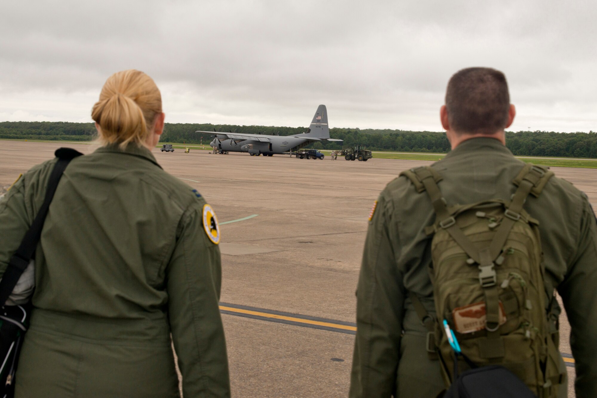 U.S. Air Force Reserve Capt. Kelly Welling and Maj. Scott Lawson, pilots assigned to the 327th Airlift Squadron, walk to an aircraft being loaded on the ramp during the August Unit Assembly Training (UTA) weekend at Little Rock Air Force Base, Ark., Aug. 13, 2016. Both Airmen helped in passing two milestones for the 913th Airlift Group by flying on the first C-130J two-ship mission on a UTA since the 913th Airlift Group’s transition from the “H” to the “J” model. (U.S. Air Force photo by Master Sgt. Jeff Walston) 