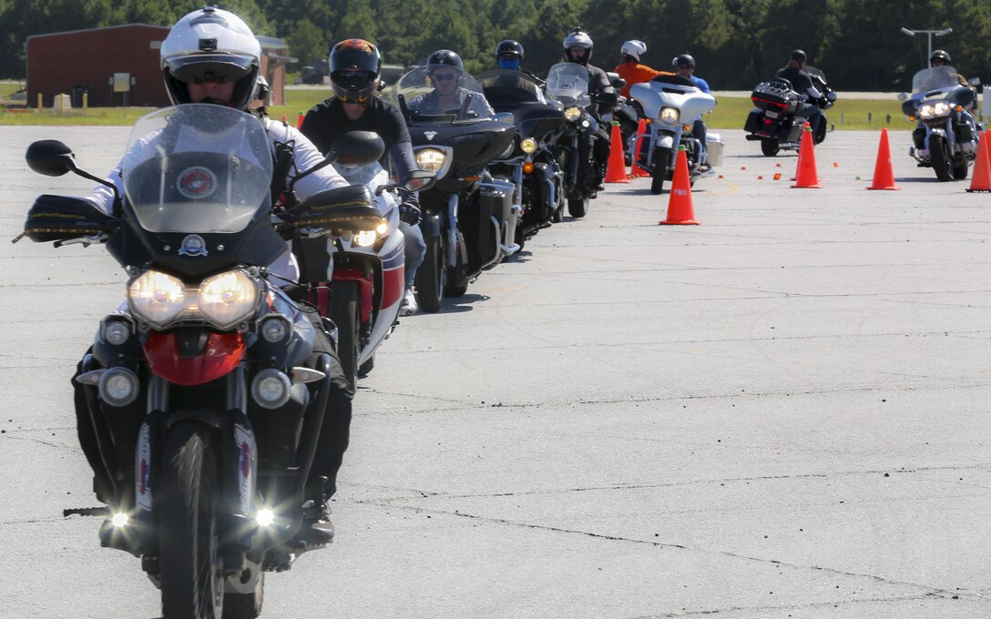 Motorcyclists follow Mark Brown, owner and lead instructor of Motor Mark 1 Motor Skill Enhancement, as they go through a simulated course in a ‘Bike Safe’ street situational environment at Marine Corps Auxiliary Landing Field Bogue, North Carolina, Aug. 14. Bike Safe is a proactive approach to engage motorcyclist before they do something that’s unsafe. (U.S. Marine Corps photo by Lance Cpl. Tavairus Hernandez /Released)