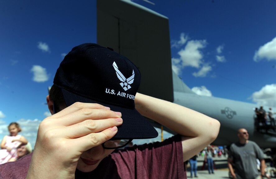 Daniel Sterling puts on an Air Force hat at the Northern Neighbors Day Air Show at Minot Air Force Base, N.D., Aug. 13, 2016. Sterling was among the 10,000 spectators at the first air show Minot AFB hosted in seven years. (U.S. Air Force photo by Staff Sgt. Chad Trujillo)