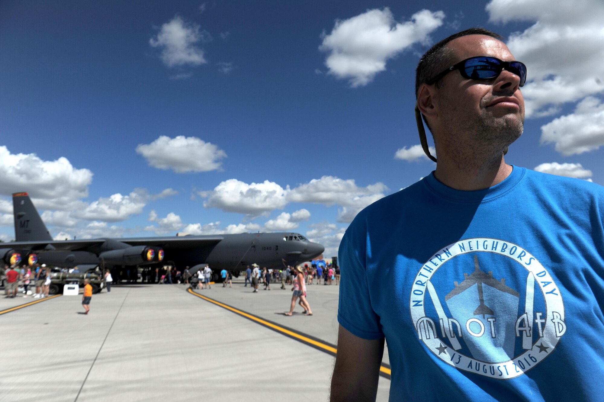 Maj. Stephen Parra, 338th Combat Training Squadron, watches a performance at the Northern Neighbors Day Air Show at Minot Air Force Base, N.D., Aug. 13, 2016. The air show was the first Minot AFB has hosted in seven years and featured several civilian and military aircraft. (U.S. Air Force photo by Staff Sgt. Chad Trujillo)