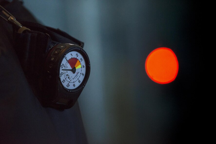 In the back of an HC-130J Combat King II, an altimeter displays nearly 23,000 feet while a solid-red light indicates to jumpers that they are not over the landing zone, Aug. 18, 2016, in the skies over Moody Air Force Base, Ga. Training jumps are typically conducted from 9,000 to 12,000 feet, but current deployed operations require an airdrop of 20,000 feet or more. (U.S. Air Force photo by Staff Sgt. Ryan Callaghan)