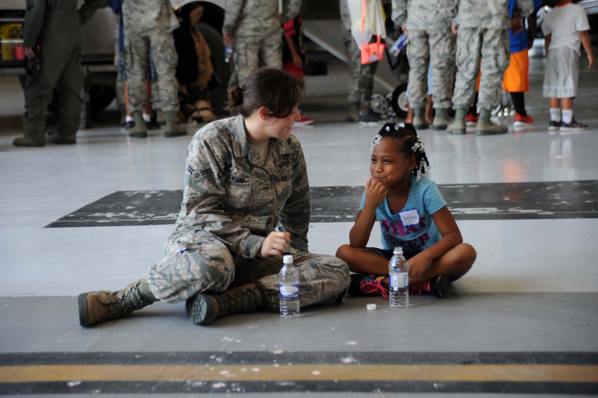 McConnell Airmen interact with children from the local community during the annual “Big for a Day” event, Aug. 9, 2016, at McConnell Air Force Base, Kan. The event, in conjunction with the organization Big Brothers Big Sisters, allowed children to learn about different jobs in the Air Force with demonstrations from base organizations like the fire department and military working dogs. “We’re hoping the kids learn and have fun today,” said Amanda Foy, Big Brothers Big Sisters volunteer enrollment specialist. “And we are also hoping to recruit some more volunteers for the program and match the kids we have here on our waiting list with a positive role model.” (U.S. Air Force photos/Airman 1st Class Jenna K. Caldwell)