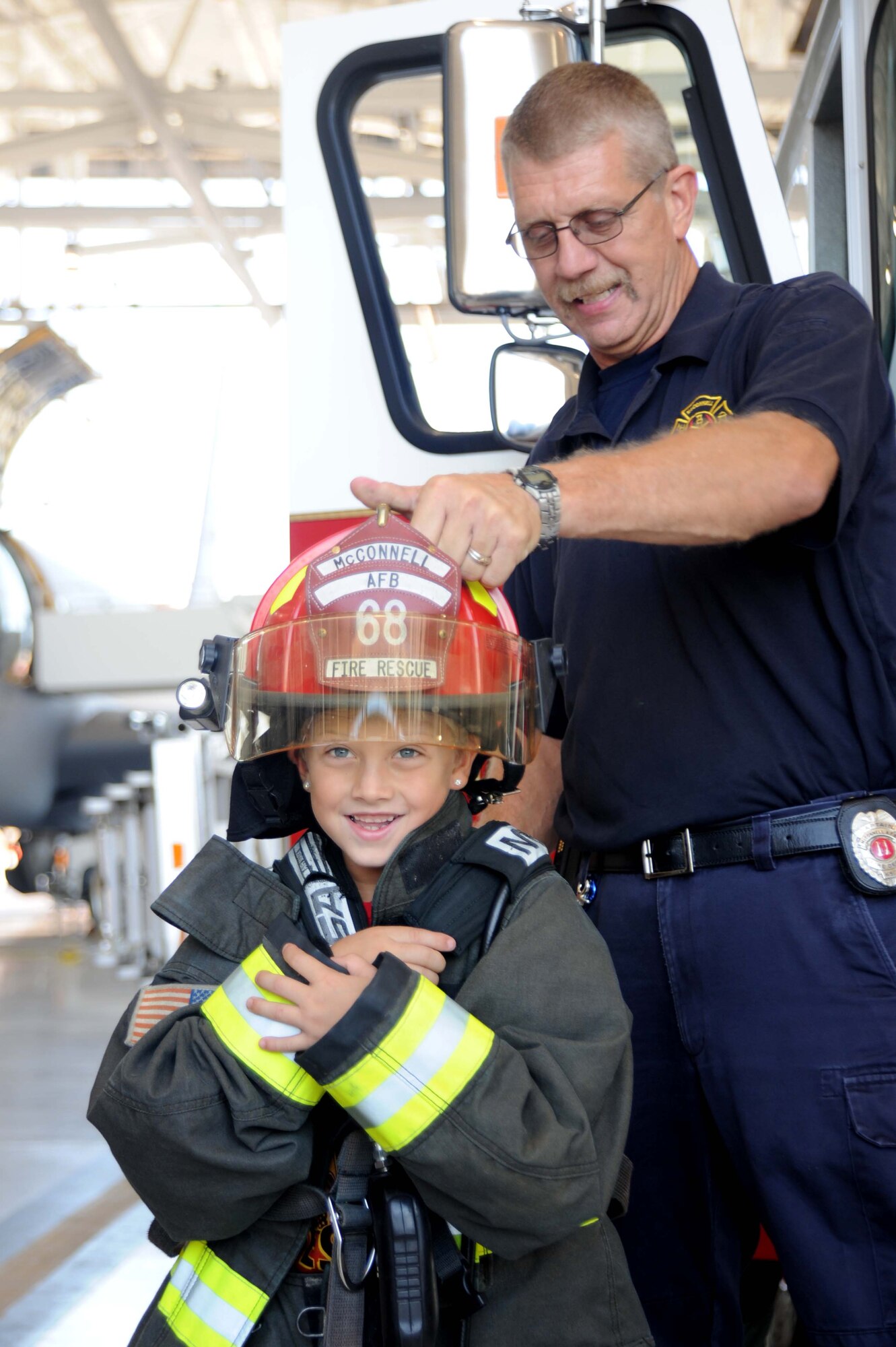 McConnell Airmen interact with children from the local community during the annual “Big for a Day” event, Aug. 9, 2016, at McConnell Air Force Base, Kan. The event, in conjunction with the organization Big Brothers Big Sisters, allowed children to learn about different jobs in the Air Force with demonstrations from base organizations like the fire department and military working dogs. “We’re hoping the kids learn and have fun today,” said Amanda Foy, Big Brothers Big Sisters volunteer enrollment specialist. “And we are also hoping to recruit some more volunteers for the program and match the kids we have here on our waiting list with a positive role model.” (U.S. Air Force photos/Airman 1st Class Jenna K. Caldwell)