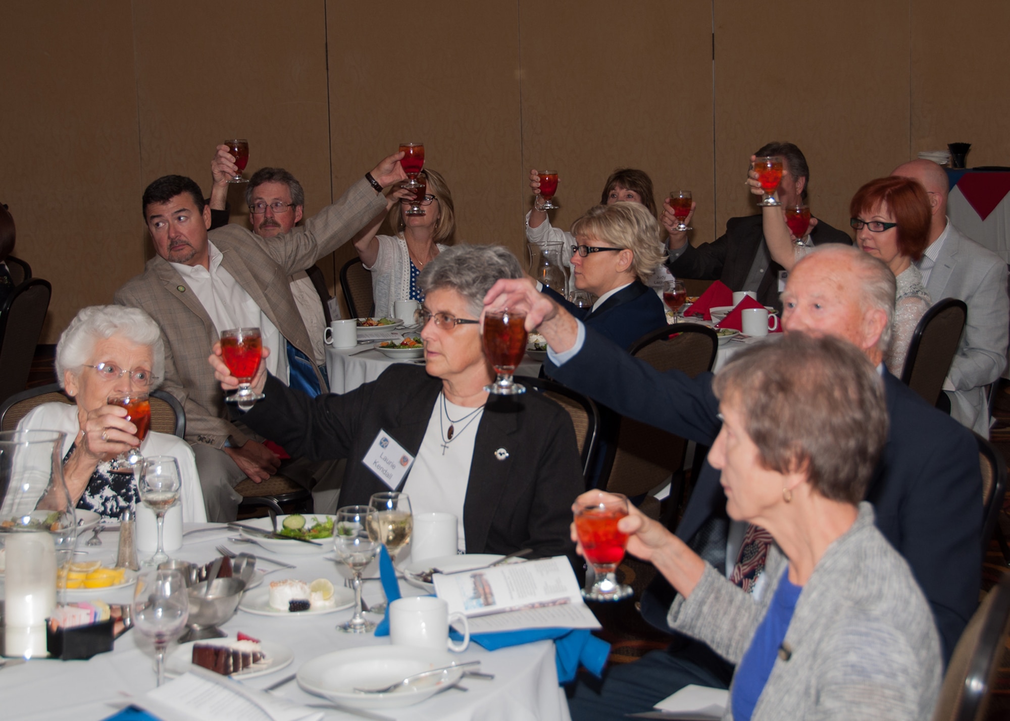 Alumni of the 307th Bombardment Group and their families take a moment to remember and toast their fallen during their annual reunion banquet in Nashville, Tennessee, on August 13, 2016. It is a time honored tradition to remember members that did not return, taken as Prisoners of War or Missing in Action. (U.S. Air Force photo by Master Sgt. Laura Siebert/Released)