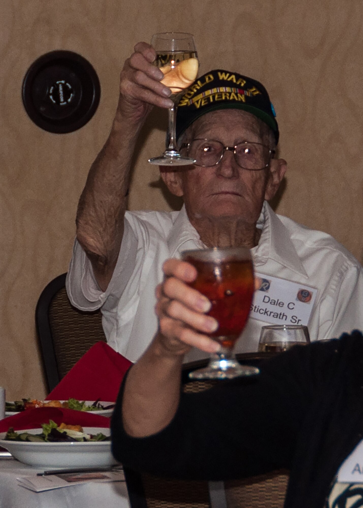 Dale Stickrath, a gunner on the B-24 Liberator during WWII, raises his glass to the fallen members of the 307th Bombardment Group during an annual reunion in Nashville, Tennessee, on August 13, 2016. Stickrath was assigned to the 371st Bomb Squadron during WWII. (U.S. Air Force photo by Master Sgt. Laura Siebert/Released)
