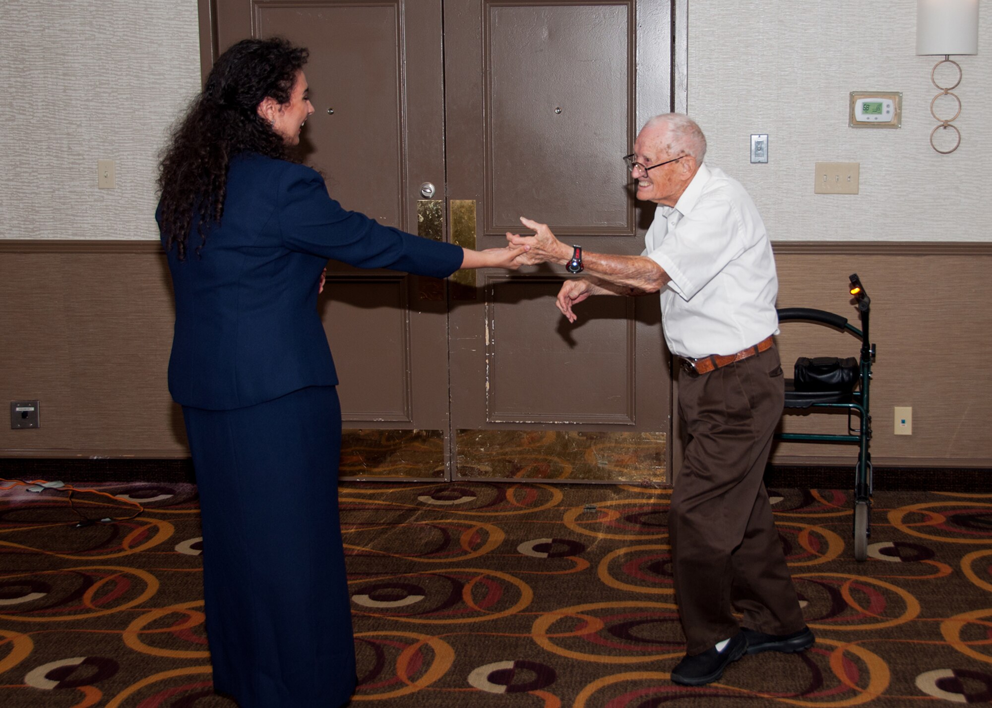 Dale Stickrath, a 307th Bombardment Group alumni, and Anna Wyzywany cut a rug to tunes of World War II at an annual reunion in Nashville, Tennessee, on August 13, 2016. Stickrath flew as a gunner in the B-24 Liberator during WWII and Wyzywany is the daughter of a member of the current 307th Bomb Wing based at Barksdale Air Force Base, Louisiana.  (U.S. Air Force photo by Master Sgt. Laura Siebert/Released)