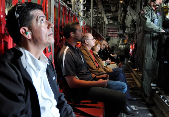 Dario Montelongo, Jr. (left) looks over the C-130 Hercules hull before taking off for an orientation flight over southern Colorado, Aug. 5, 2016. More than 40 other employers and supervisors, took part in the wing's annual Employer Appreciation Day at the base. The day aims to both educate and recognize employers and supervisors of AF Reservists for their ongoing support to the member's military commitment. Vanselow is a regional operations manager for Solar Transport, while Peterson is a quality assistance supervisor with the Defense Contracts Management Agency. Montelongo is an area chairman for the Colorado Employer Support for the Guard and Reserve organization, providing support to employers throughout the Longmont and Boulder areas. (U.S. Air Force photo/2nd Lt. Stephen J. Collier)