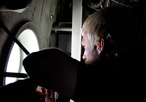 A visiting Air Force Reservist employer stares out the porthole of a C-130 Hercules during an orientation flight over southern Colorado, Aug. 5, 2016. More than 40 other employers and supervisors, took part in the wing's annual Employer Appreciation Day at the base. The day aims to both educate and recognize employers and supervisors of AF Reservists for their ongoing support to the member's military commitment. (U.S. Air Force photo/2nd Lt. Stephen J. Collier)