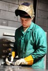 Senior Airman Caleb Ray, 5th Maintenance Squadron metals technology journeyman, welds the edge of a piece of metal at Minot Air Force Base, N.D., Aug. 18, 2016. The base welding shop repairs a wide range of base equipment including aircraft and vehicle parts. (U.S. Air Force photo/Senior Airman Kristoffer Kaubisch)