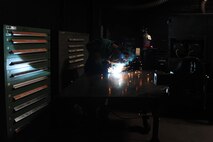 Senior Airman Caleb Ray, 5th Maintenance Squadron metals technology journeyman, welds the edge of a piece of metal at Minot Air Force Base, N.D., Aug. 18, 2016. Ray is one of many members of Team Minot who contributes his knowledge and skills to help keep the mission running. (U.S. Air Force photo/Senior Airman Kristoffer Kaubisch)