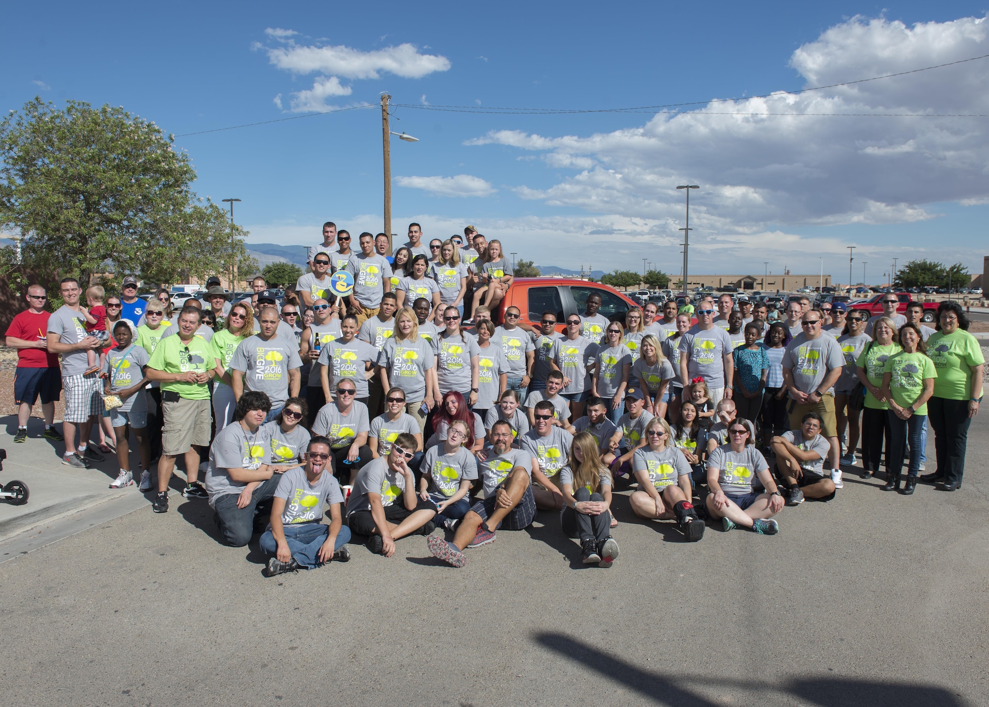 Volunteers pose for a photo at the Big Give after-party August 12, 2016 at Holloman Air Force Base, N.M. Over the course of three weeks, 32 teams of 412 participants spent nearly 5,000 man hours volunteering in the local community — saving the area $202,092.33. (Last names are being withheld due to operational requirements. U.S. Air Force photo by Airman 1st Class Randahl J. Jenson)