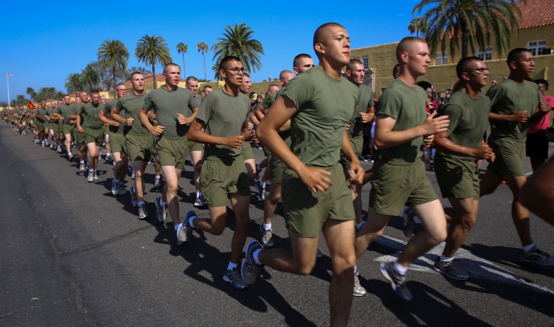 Marines of Alpha Company, 1st Recruit Training Battalion, run in formation during their motivation run at Marine Corps Recruit Depot San Diego, Aug. 18. The run serves as the last physical training event before graduation. Annually, more than 17,000 males recruited from the Western Recruiting Region are trained at MCRD San Diego. Alpha Company is scheduled to graduate Aug. 19.
