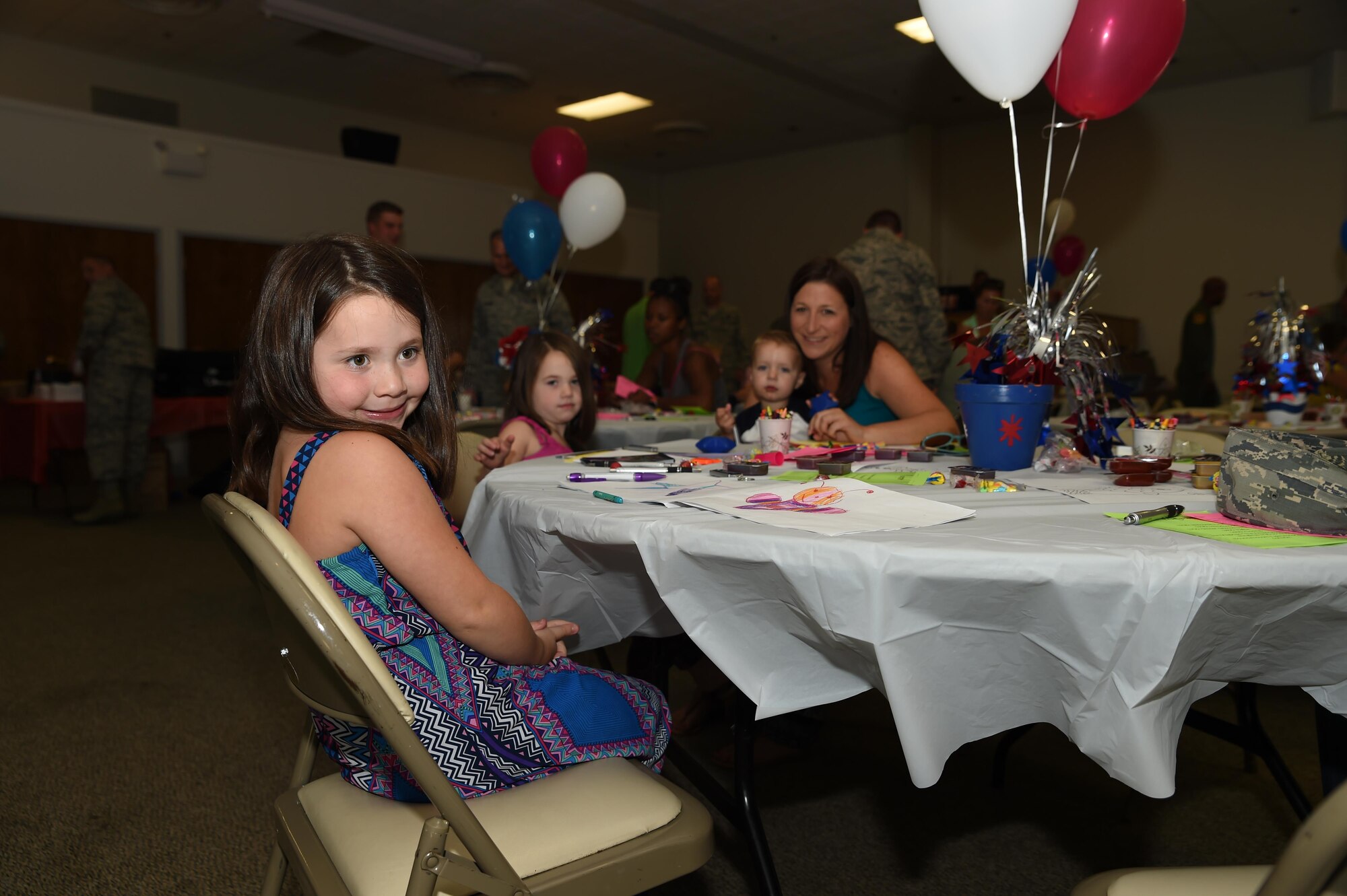 A child of a deployed McChord member attends the Deployed Family Dinner August 15, 2016, at the Chapel Support Center, Joint Base Lewis-McChord, Wash. The 62nd Operations Support Squadron hosted and coordinated the quarterly event for families to enjoy. (U.S. Air Force photo/Staff Sgt. Naomi Shipley)