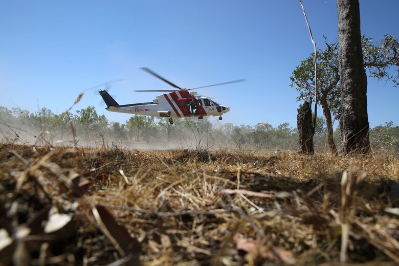 A Sikorsky S76A++ Search and Rescue helicopter hovers during SAR training at Exercise Pitch Black 2016, Royal Australian Air Force Base Tindal, Australia, Aug. 16, 2016. The SAR team trains with local and international forces during exercises like Pitch Black to ensure all medical personnel that can respond to an aircraft emergency are capable of carrying out the same procedures. The biennial, multinational exercise involves approximately 10 allied nations and prepares these forces for possible real-world scenarios. The bilateral effort amongst Exercise Pitch Black 2016 furthermore showcases the strength amongst various militaries and solidifies the relationship across the Pacific region. (U.S. Marine Corps photo by Cpl. Nicole Zurbrugg)