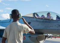 U.S. Air Force Senior Airman Christopher Tidline, a 354th Maintenance Squadron aircrew egress technician who is cross-utilized as a crew chief for the 354th Aircraft Maintenance Squadron, salutes Royal Canadian Air Force Capt. Michael Walker, an 18th Aggressor Squadron pilot, as he leaves for a sortie Aug. 17, 2016, during RED FLAG-Alaska 16-3 at Eielson Air Force Base, Alaska. This exercise provides unique opportunities to integrate various forces into joint, coalition and multilateral training from simulated forward operating bases. (U.S. Air Force photo by Staff Sgt. Shawn Nickel)