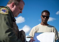 U.S. Air Force Senior Airman Christopher Tidline, a 354th Maintenance Squadron aircrew egress technician, works in a crew chief’s role preparing a pilot for a sortie Aug. 17, 2016, during RED FLAG-Alaska 16-3 at Eielson Air force Base, Alaska. Tidline qualified in more than 15 additional tasks to perform the roles he volunteered for, which alleviates manning issues in the 354th Aircraft Maintenance Squadron. (U.S. Air Force photo by Staff Sgt. Shawn Nickel)
