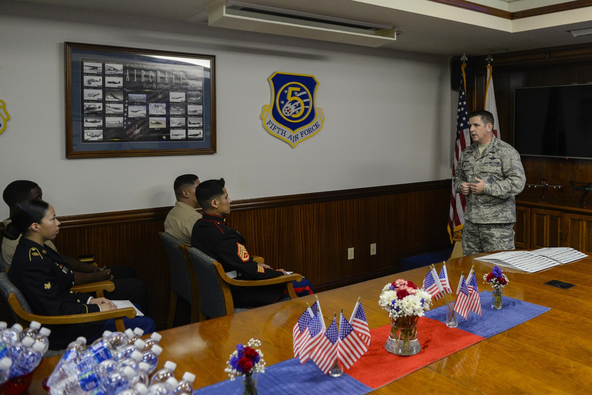 Col. Christopher Amrhein, 18th Wing vice commander, speaks to the new U.S. citizens about the impact they will have on their great country during a U.S. Naturalization Ceremony Aug. 17, 2016, at Kadena Air Base, Japan. This ceremony recognized the members as full-fledged U.S. citizens. Under special provisions in Section 329 of the Immigration and Nationality Act, the President signed an executive order July 3, 2002, authorizing all non-citizens who have served honorably in the U.S. armed forces on or after Sept. 11, 2001, to immediately file for citizenship. This order also covers veterans of certain designated past wars and conflicts. (U.S. Air Force photo by Senior Airman Stephen G. Eigel)