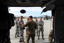 U.S. Airmen assigned to the 354th Medical Operations Squadron at Eielson Air Force Base, Alaska, receive instructions on transporting a casualty to a helicopter during joint training Aug. 12, 2016, outside Hangar 6 on Ladd Army Airfield at Fort Wainwright, Alaska. This portion of the training was conducted with U.S. Army UH-60 Black Hawk helicopter and it medevac crew. (U.S. Air Force photo by Airman Isaac Johnson)
