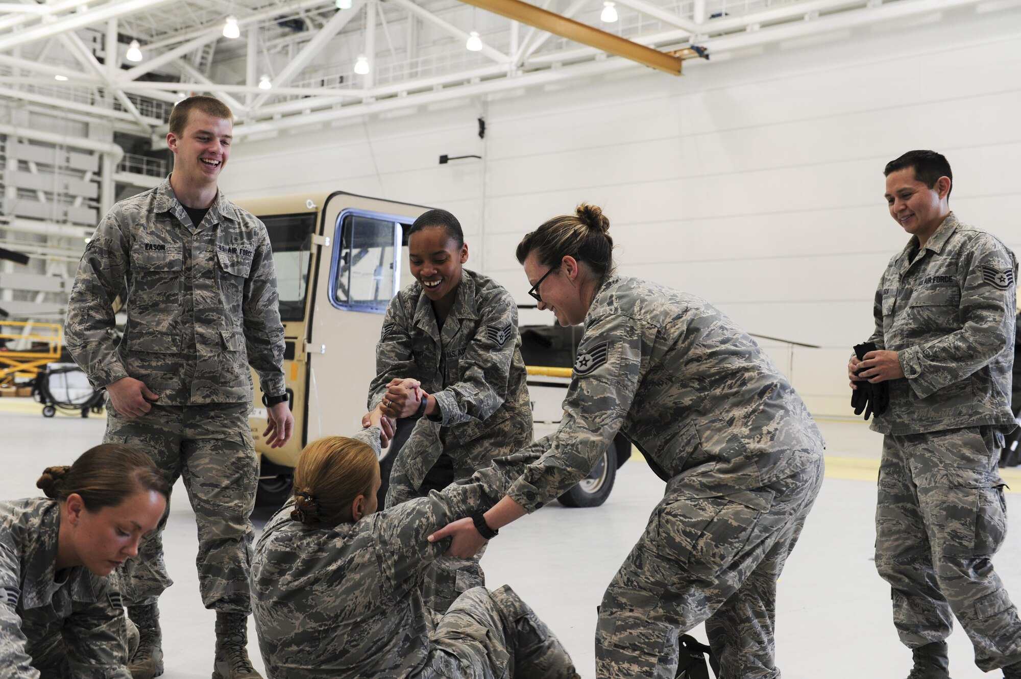 U.S. Airmen assigned to the 354th Medical Operations Squadron at Eielson Air Force, Alaska, participate in joint training Aug. 12, 2016, in Hangar 6 at Ladd Army Airfield on Fort Wainwright, Alaska. Members of the 354th Medical Group trained in preparation for the upcoming Emergency Medical Technician (EMT) Rodeo, a competition where EMT teams demonstrate their lifesaving skills under austere conditions. (U.S. Air Force photo by Airman Isaac Johnson)

