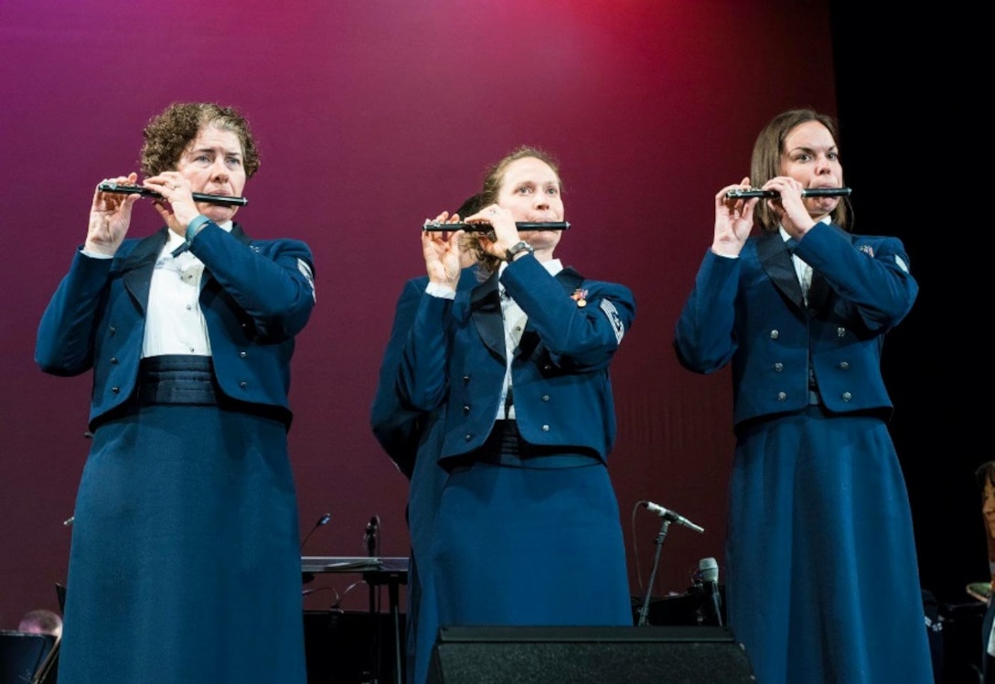 SMSgt Sandra Tiemens, TSgt Julia Taylor, and SrA Jen Nelson, of our flute section perform a feature from John Phillip Sousa's Stars and Stripes Forever.