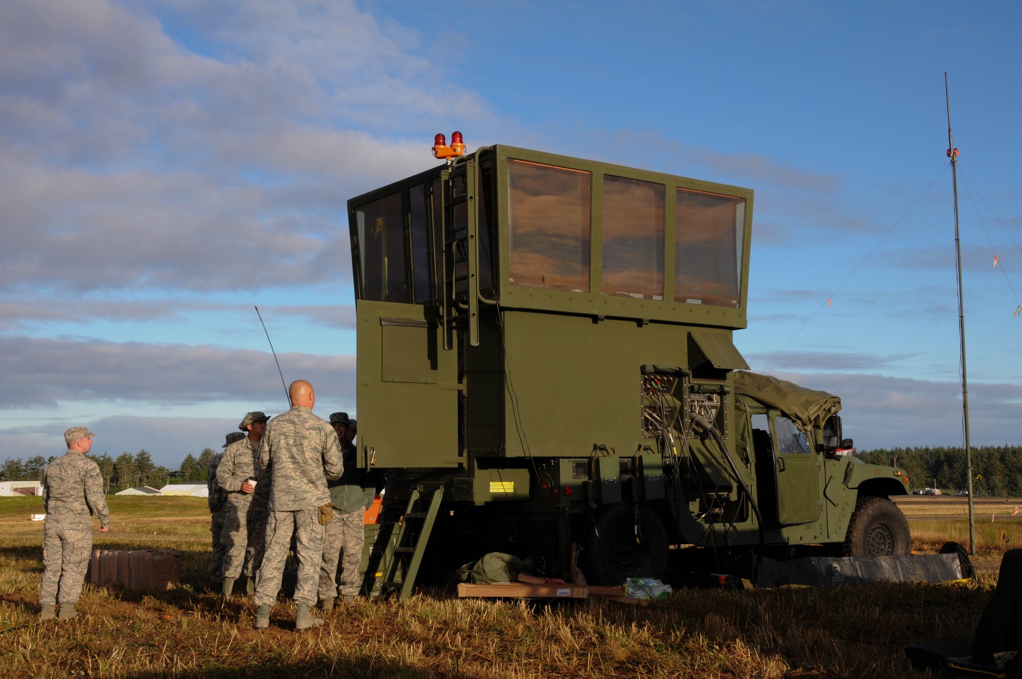 160810-Z-CT752-026: Oregon Air National Guard members, 270th Air Traffic Control Squadron, gather to begin their day during the ATCS annual training at Newport, Ore., Aug. 10, 2016. Members convoyed nearly 300 miles from Klamath Falls, Ore., where they set up their MSN-7 mobile tower, TRN-48 Tactical Air Navigation (TACAN) system, and all supporting equipment which allows them to guide aircraft into and out of nearly any airfield in the world. (U.S. Air National Guard photo by Staff Sgt. Penny Snoozy)