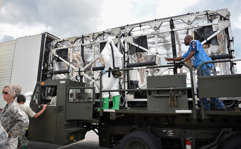 A Transportation Isolation System (TIS) is loaded into the TIS Hot Air Decontamination System (THADS) at Joint Base Charleston during Exercise Mobility Solace, Aug. 17, 2016. Mobility Solace provides Air Mobility Command, working with joint partners, the opportunity to evaluate the protocols and operational sequences of moving multiple patients exposed or infected with Ebola using the TIS, while also minimizing the risks to aircrew, medical attendants and the airframe. The TIS is a modular, scalable system, composed of at least one isolation pallet for patient transportation and care, one pallet configured as an antechamber to provide medical members with an enclosed space to safely decontaminate and remove their personal protective equipment before exiting. (U.S. Air Force Photo/Airman Megan Munoz)