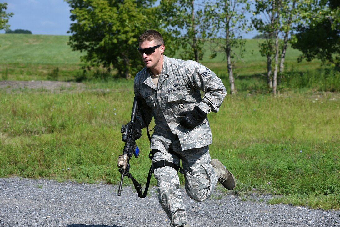 Senior Airman Brendan Leach, 109th Security Forces Squadron, goes through a combat combative obstacle course on Aug. 11, 2016 at Stratton Air National Guard Base, New York. The course was part of a weeklong pre-deployment training Warrior Week for Security Forces Airmen here. (U.S. Air National Guard photo by Master Sgt. William Gizara/Released)