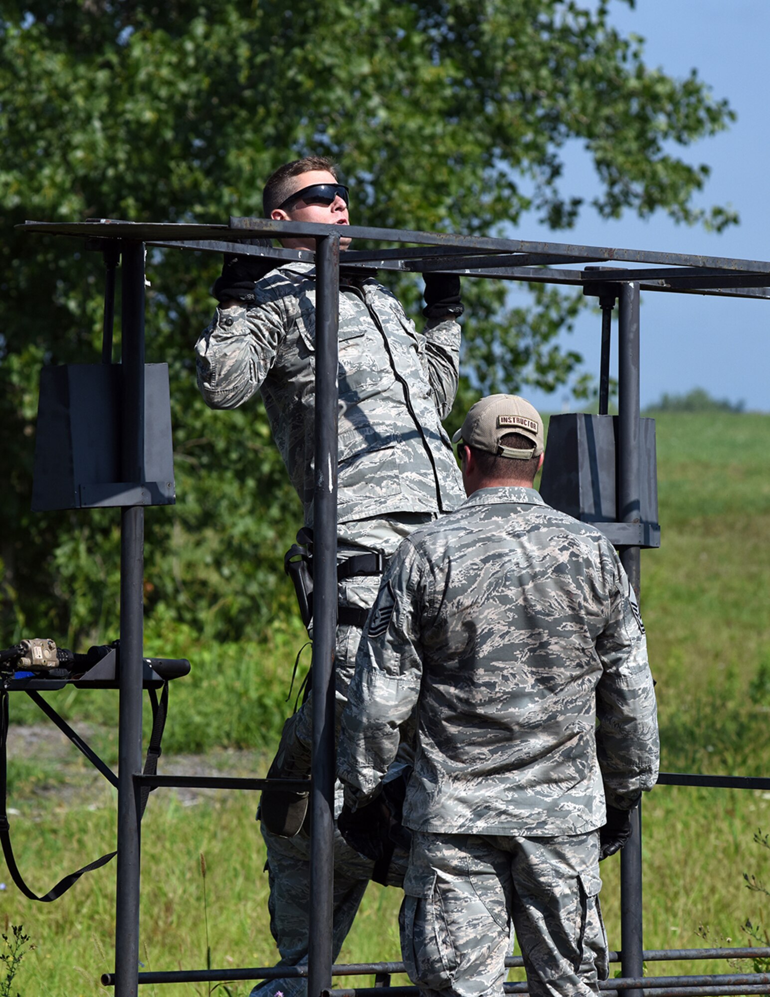 Senior Airman Brendan Leach, 109th Security Forces Squadron, goes through a combat combative obstacle course on Aug. 11, 2016 at Stratton Air National Guard Base, New York. The course was part of a weeklong pre-deployment training Warrior Week for Security Forces Airmen here. (U.S. Air National Guard photo by Master Sgt. William Gizara/Released)