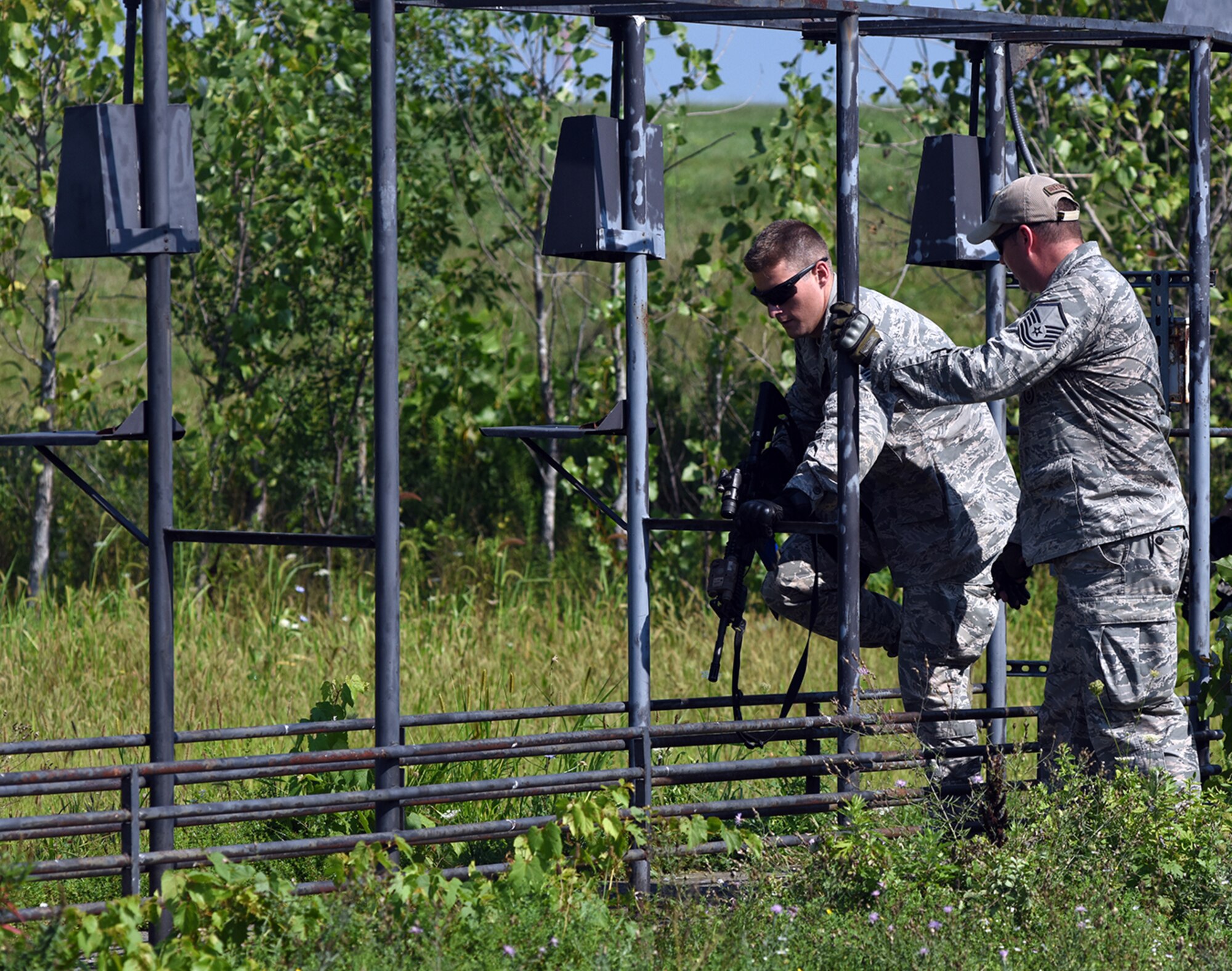 Senior Airman Brendan Leach, 109th Security Forces Squadron, goes through a combat combative obstacle course on Aug. 11, 2016 at Stratton Air National Guard Base, New York. The course was part of a weeklong pre-deployment training Warrior Week for Security Forces Airmen here. (U.S. Air National Guard photo by Master Sgt. William Gizara/Released)