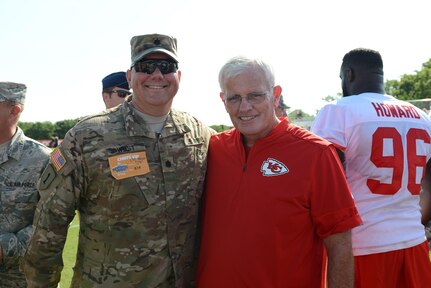 U.S. Army Lt. Col. James R. West, assigned to U.S. Strategic Command's (USSTRATCOM) Joint Functional Component Command for Global Strike, poses for a photo with Bob Sutton, Kansas City Chiefs defensive coordinator, after the final practice of the team's training camp in St. Joseph, Mo., Aug. 18, 2016. The two share a relationship which dates back to when West played college football at the U.S. Military Academy under then-head coach Sutton. Service members assigned to Offutt Air Force Base, Neb.; Fort Riley, Kan.; Fort Leavenworth, Kan.; Whiteman AFB, Mo.; and Rosecrans Reserve Air National Guard Base, Mo.; observed the Chiefsâ€™ practice session, and were invited onto the field to meet with players and coaches. Following the practice session, Chiefs head coach Andy Reid presented game balls to several joint and international military members. One of nine DoD unified combatant commands, USSTRATCOM has global strategic missions assigned through the Unified Command Plan, which include strategic deterrence; space operations; cyberspace operations; joint electronic warfare; global strike; missile defense; intelligence, surveillance and reconnaissance; combating weapons of mass destruction; and analysis and targeting. (U.S. Air Force photo by Staff Sgt. Jonathan Lovelady)