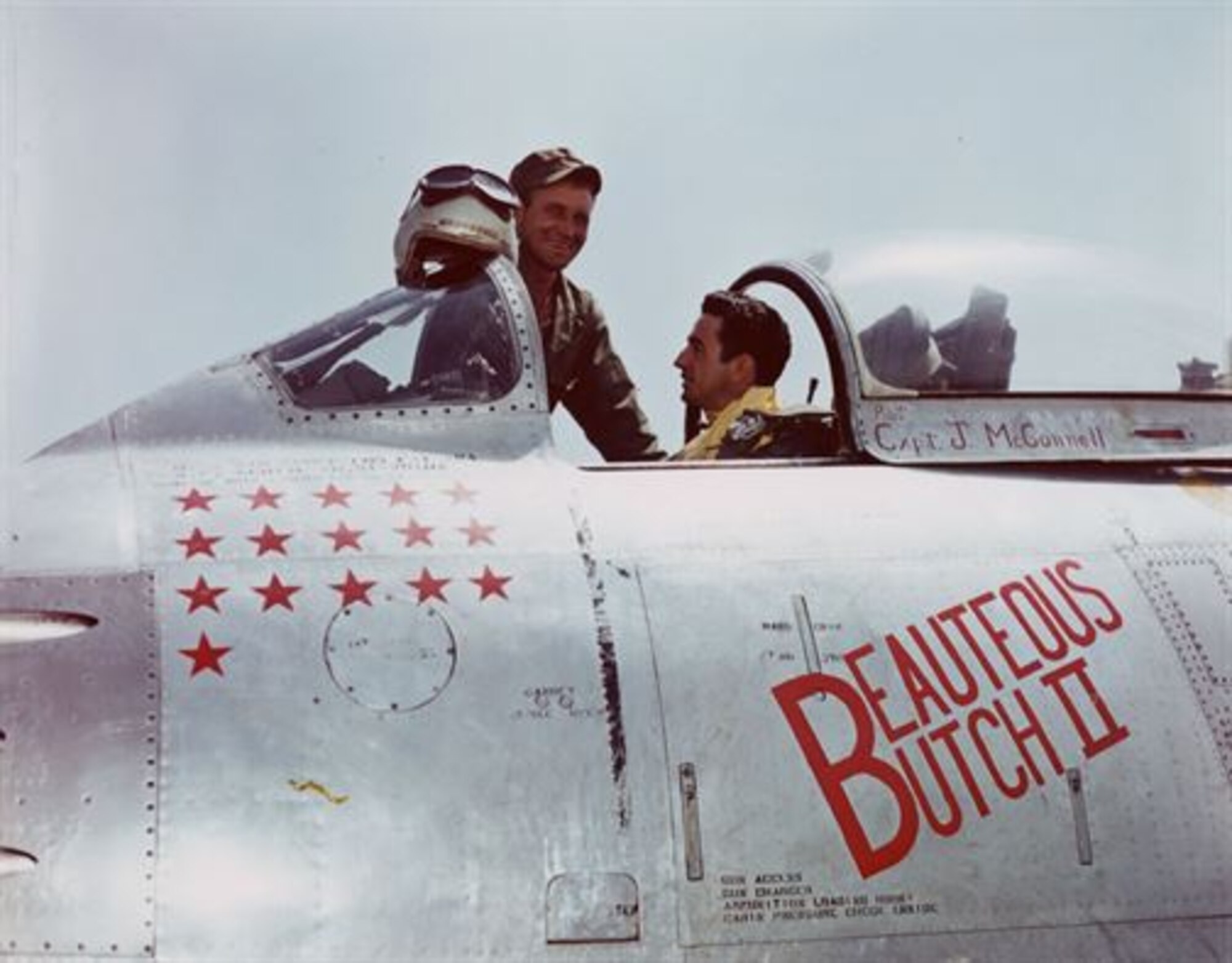 Capt. Joseph McConnell, center, sits in the cockpit of his F-86 Sabre before a combat sortie during the Korean War. McConnell was the war’s top American ace, scoring 16 confirmed kills, and the Air Force’s first triple jet-on-jet ace. (Courtesy photo)
