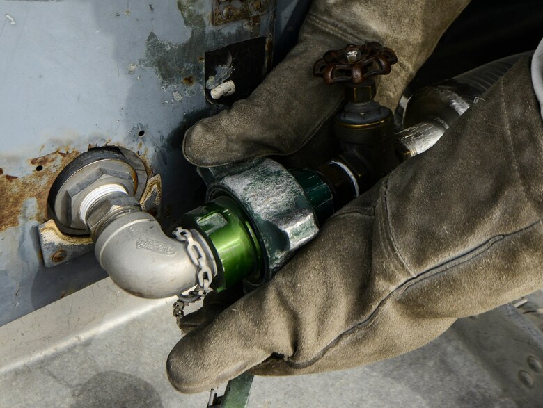 Senior Airman Donte Hatcher, 379th Expeditionary Logistics Readiness Squadron fuels cryogenics operator, connects a hose into a 50-gallon liquid oxygen tank during an inspection Aug. 5, 2016, at Al Udeid Air Base, Qatar. The cryogenics team here not only provides aircrews pure oxygen when conducting missions, but they also supply liquid oxygen and liquid nitrogen to warfighters in Kuwait, Afghanistan and Iraq. (U.S. Air Force photo/Senior Airman Janelle Patiño/Released)