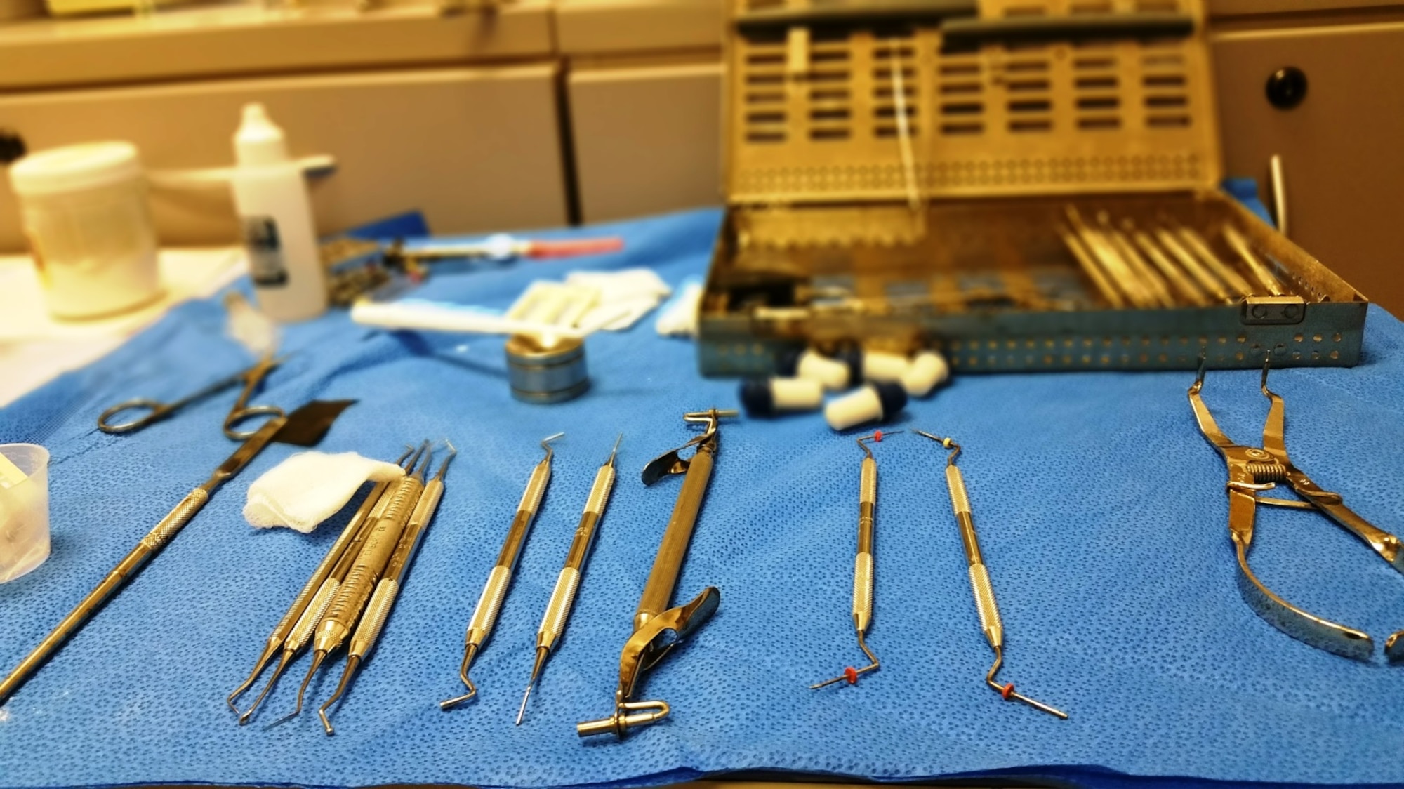 Dental tools readied by Staff Sgt. Shane Hinton, 379th Expeditionary Medical Operations Squadron dental technician, on standby to be used in a procedure on Senior Airman Jordan Thompson, 379th Expeditionary Logistics Readiness Squadron fuels and cryogenics operator, July 30, 2016, at Al Udeid Air Base, Qatar. Deployed dental technicians like Hinton deliver essential dental care to keep all deployed service members and coalition partners mission-ready. (U.S. Air Force photo/Technical Sgt. Carlos J. Treviño/Released)