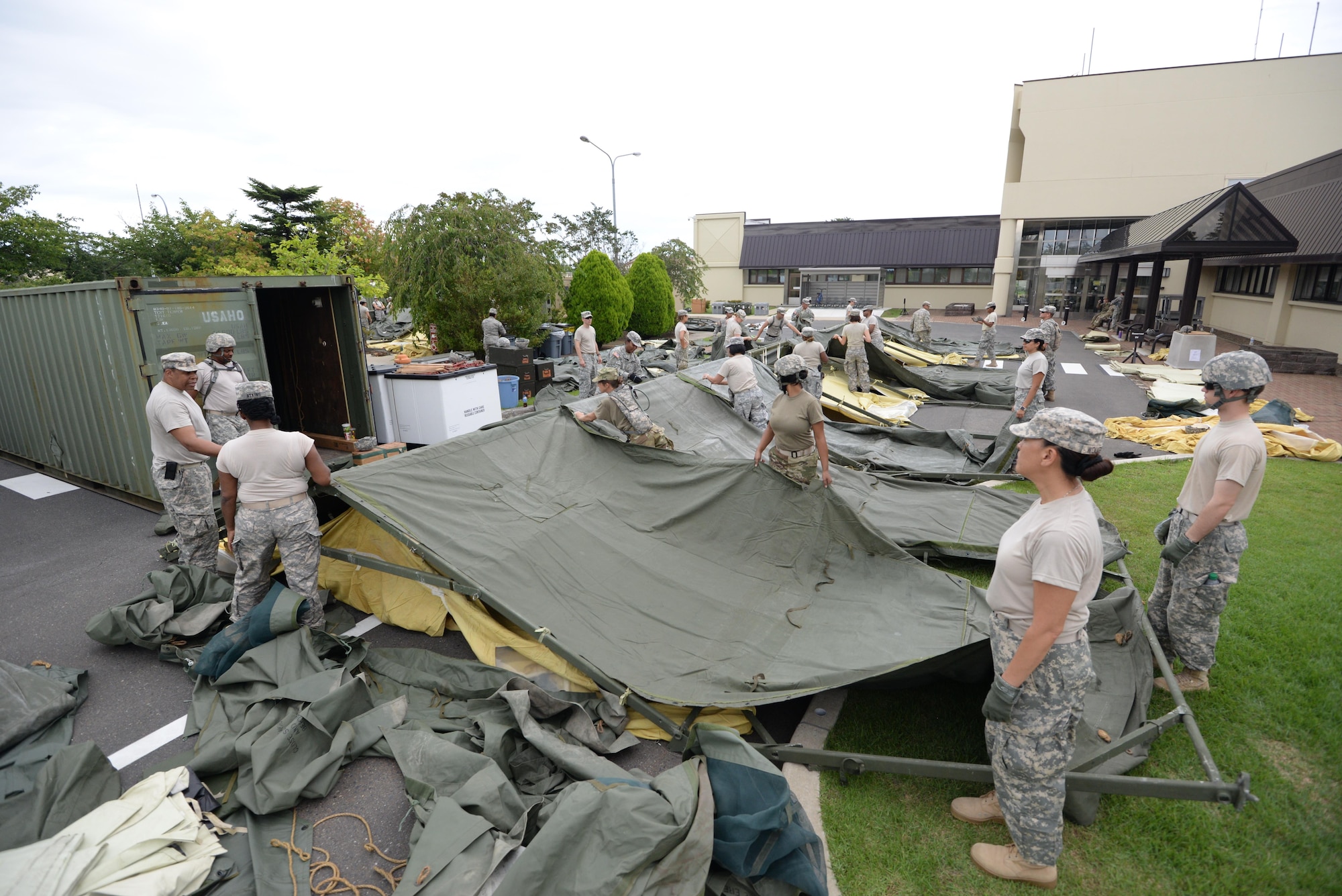 U.S. Army Soldiers from the 228th Combat Support Hospital, U.S. Army Reserve unit construct tents in support of a medical exercise at Misawa Air Base, Japan, Aug. 18, 2016. The 228th CSH will be conducting joint exercises with the 35th Medical Group over the course of a week. (U.S. Air Force photo by Senior Airman Jarrod Vickers) 