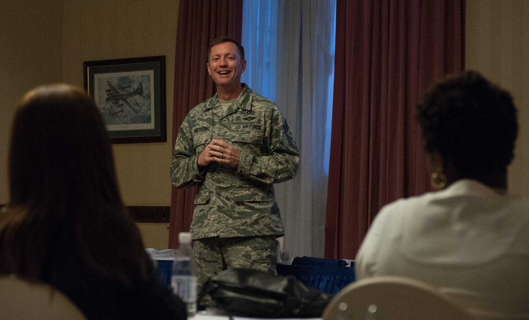 Chief Master Sgt. George Anderson, United States Air Forces in Europe Squadron Section Commander first sergeant, shares advice with a group of spouses during a professional enhancement seminar Aug. 11, 2016, at Ramstein Air Base, Germany. The PES trains senior NCO selects in areas such as stress management, ethics, core values, mentoring and counseling. (U.S. Air force photo/Airman 1st Class Lane T. Plummer)