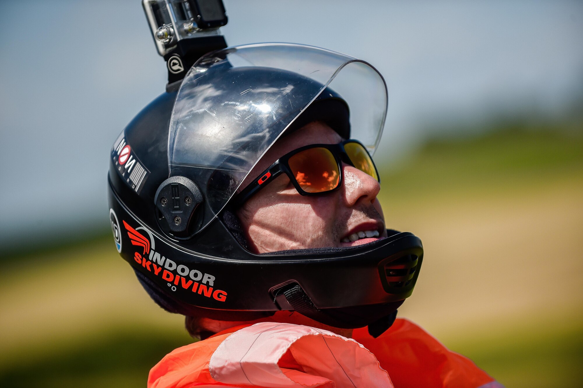 A skydiver watches as Airmen from Ramstein Air Base, Germany, land after a tandem jump over Wallerfangen, Germany, Aug. 13, 2016. The 86th Airlift Wing Chapel and Club 7 gave 15 Airmen from Ramstein the opportunity to take a ‘leap of faith’ to build upon the pillars of RUfit. (U.S. Air Force photo/Senior Airman Nicole Keim)