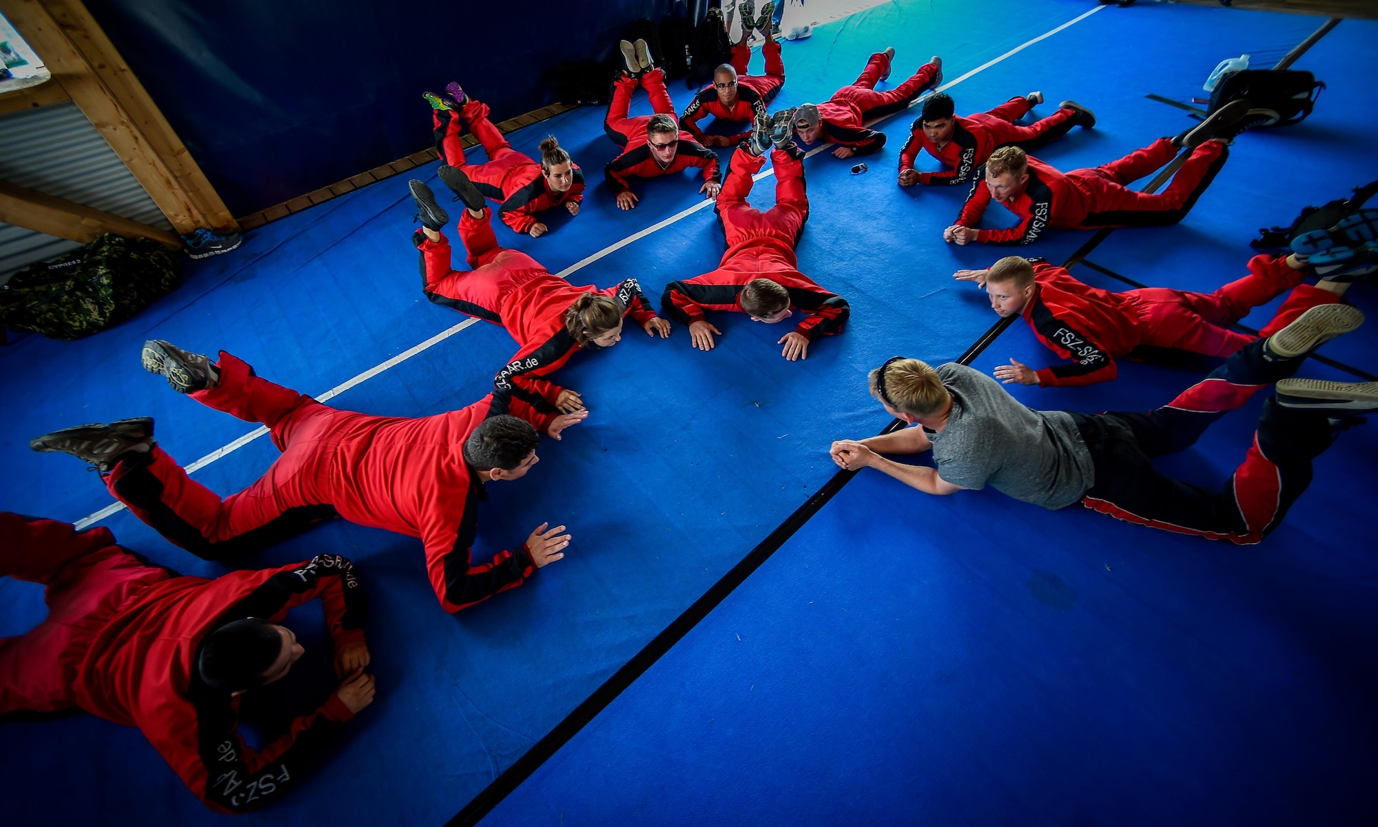 Airmen from Ramstein Air Base, Germany, learn jumping procedures before skydiving over Wallerfangen, Germany, Aug. 13, 2016. The purpose of the trip was to improve the spiritual fitness of the Airmen by allowing them to take a leap of faith. (U.S. Air Force photo/Senior Airman Nicole Keim) 