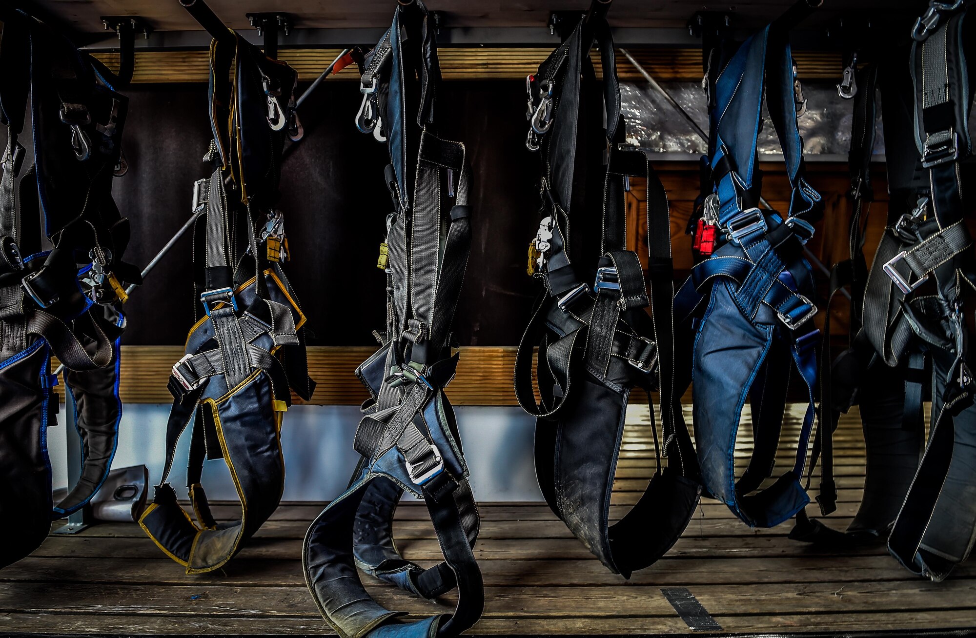 Skydiving harnesses hang on a rack in Wallerfangen, Germany, Aug. 13, 2016. The 86th Airlift Wing Chapel and Club 7 gave 15 Airmen from Ramstein Air Base, Germany, the opportunity to take a ‘leap of faith’ during a skydiving trip to build upon the pillars of RUfit. (U.S. Air Force photo/Senior Airman Nicole Keim)
