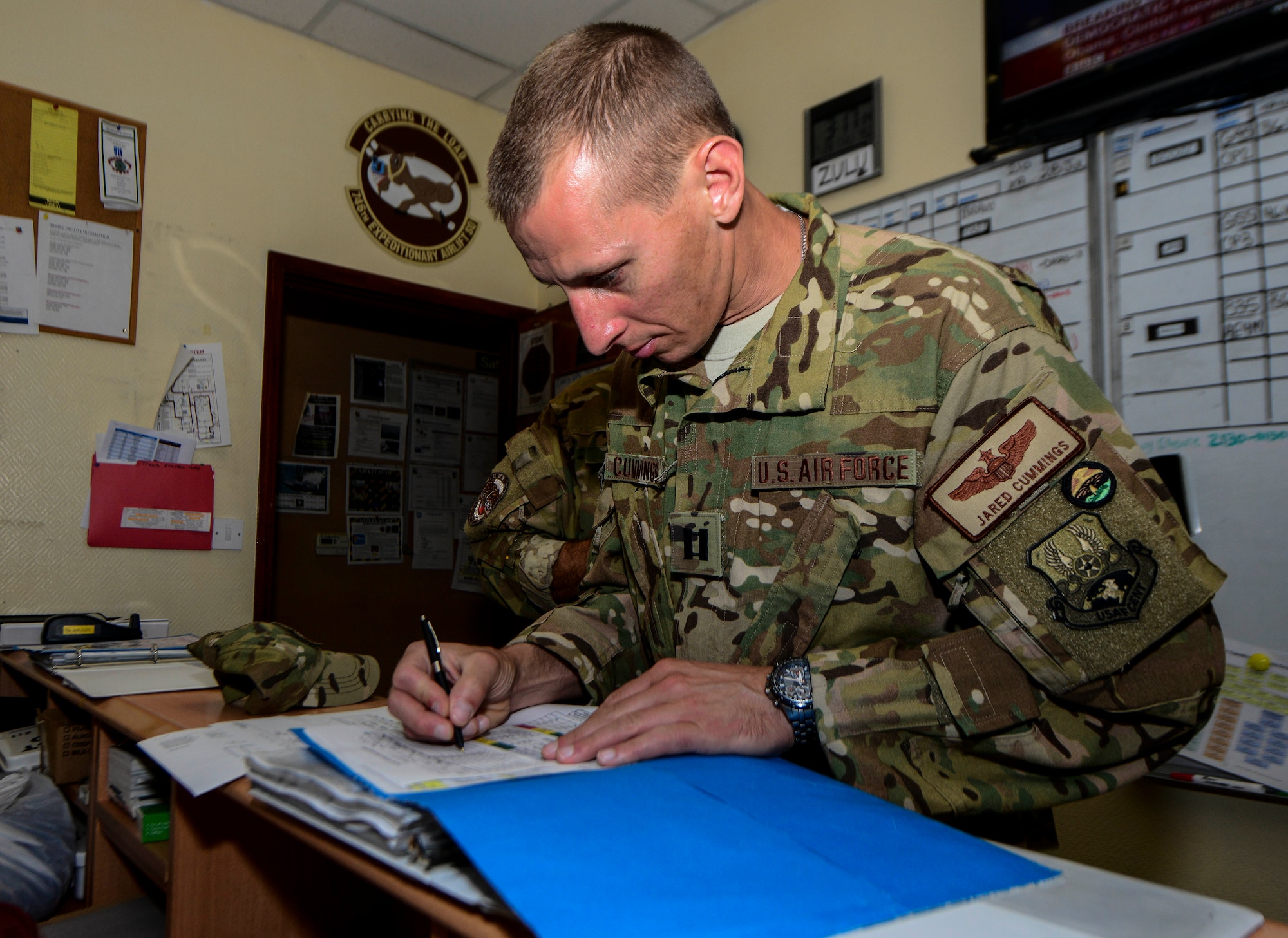 Capt. Jared Cummings, 746th Expeditionary Airlift Squadron aircraft commander, reviews the crew resource management paperwork prior to conducting a mission on a C-130H Hercules July 28, 2016, at Al Udeid Air Base, Qatar. Airmen from the 746th EAS conduct intratheater airlifts, medical evacuation and airdrop missions throughout the U.S. Air Forces Central Command’s area of responsibility in support of Operation Inherent Resolve and Operations Freedom’s Sentinel. (U.S. Air Force photo/Senior Airman Janelle Patiño/Released)