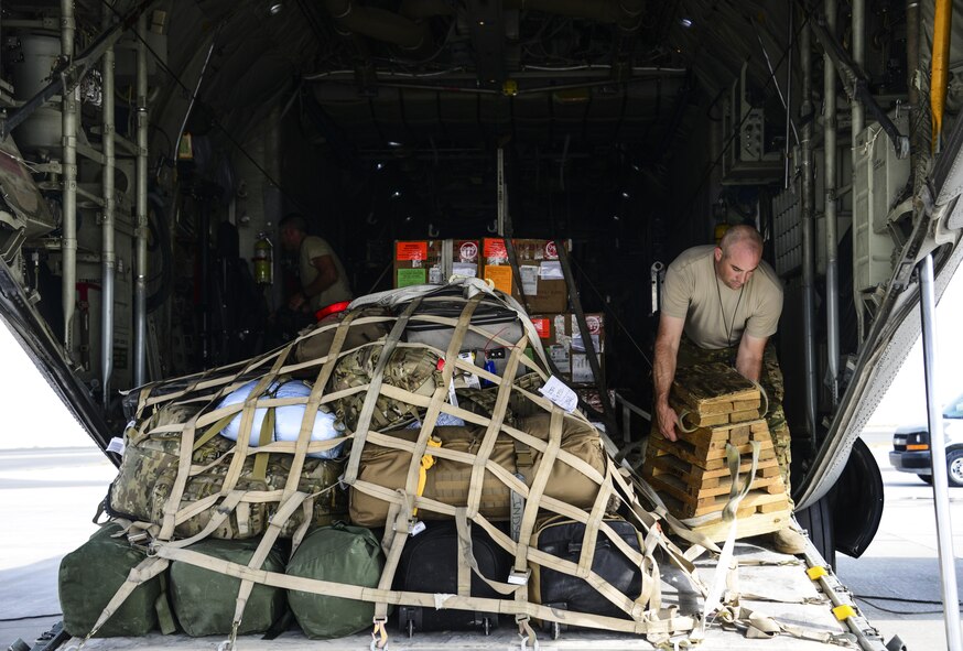 Master Sgt. Paul Serafini, 746th Expeditionary Airlift Squadron loadmaster, secures a milk stool ramp support platform and straps down a cargo load on a C-130 Hercules prior to take off June 28, 2016, at Al Udeid Air Base, Qatar. C-130 maintainers and operations group from the 914th Airlift Wing out of Niagara Falls Air Reserve Station, N.Y. have deployed here since 2005 to support the U.S. Air Forces Central Command’s mission. (U.S. Air Force photo/Senior Airman Janelle Patiño/Released)