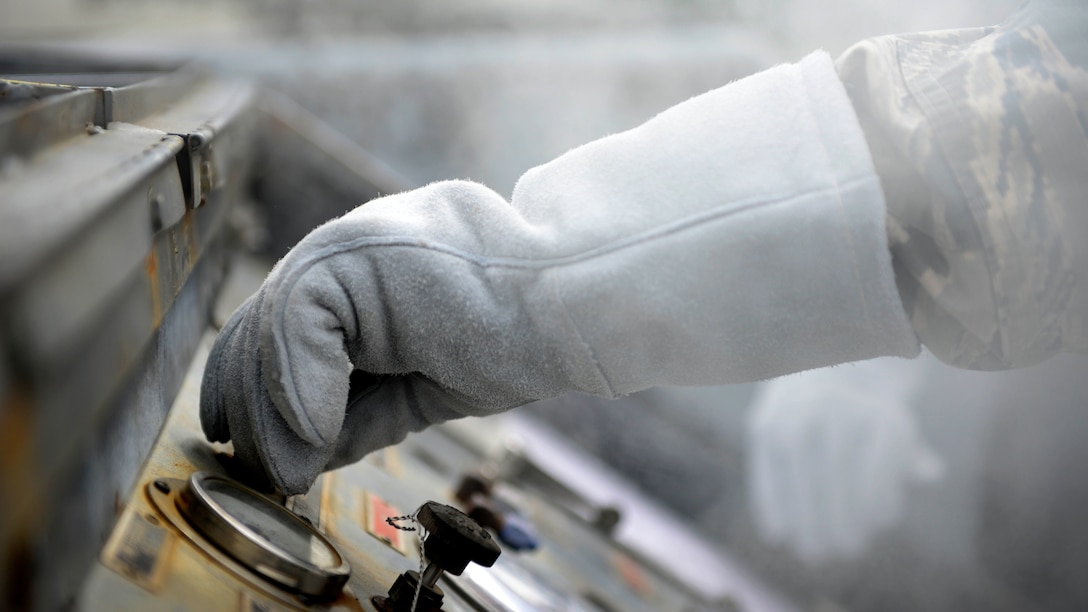 Staff Sgt. Chantz Wyant, 31st Logistics Readiness Squadron fuels facility supervisor, fills a liquid nitrogen cart, Aug. 10, 2016, at Aviano Air Base, Italy. Cryogenics Airmen must wear special equipment to protect themselves from the liquid oxygen and nitrogen’s dangerously low temperatures of minus 297 and minus 320 degrees Fahrenheit respectively. (U.S. Air Force photo by Senior Airman Areca T. Bell/Released)
