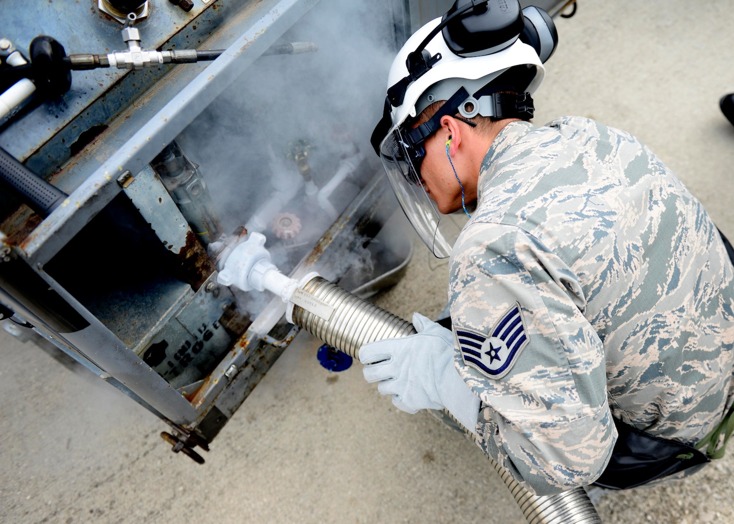 Staff Sgt. Chantz Wyant, 31st Logistics Readiness Squadron fuels facility supervisor, fills a liquid nitrogen cart, Aug. 10, 2016, at Aviano Air Base, Italy. Cryogenics Airmen fill an average of 1,200 gallons of liquid oxygen and 1,200 gallons of liquid nitrogen monthly. (U.S. Air Force photo by Senior Airman Areca T. Bell/Released)