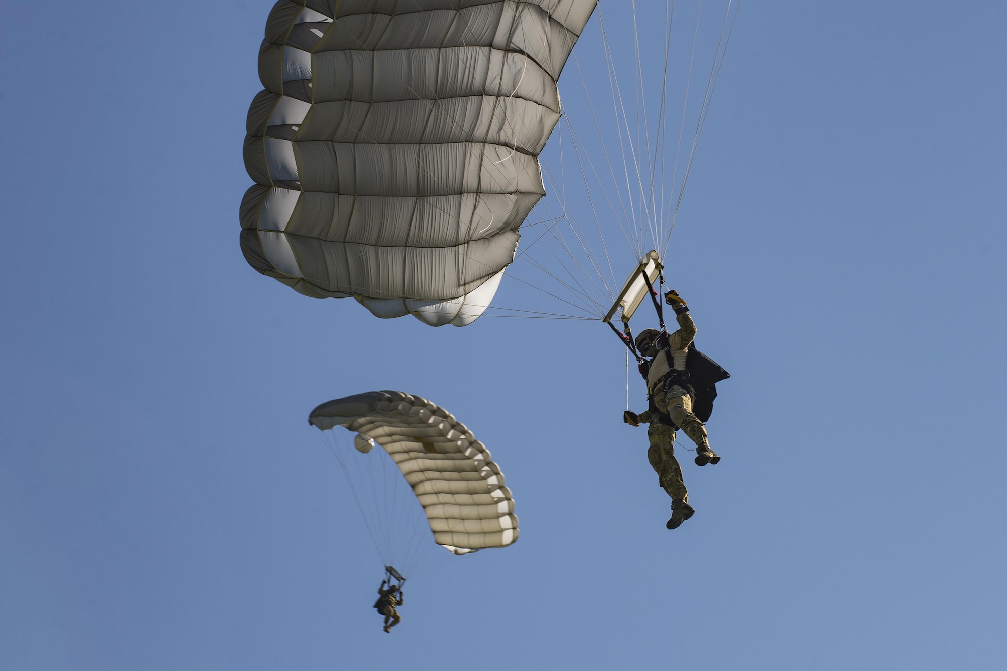 Pararescuemen from the 38th Rescue Squadron glide toward the landing zone during a high-altitude, low-opening jump, Aug. 18, 2016, at Moody Air Force Base, Ga. The Airmen jumped from one of Moody’s HC-130J Combat King IIs for training purposes. (U.S. Air Force photo by Airman 1st Class Daniel Snider)