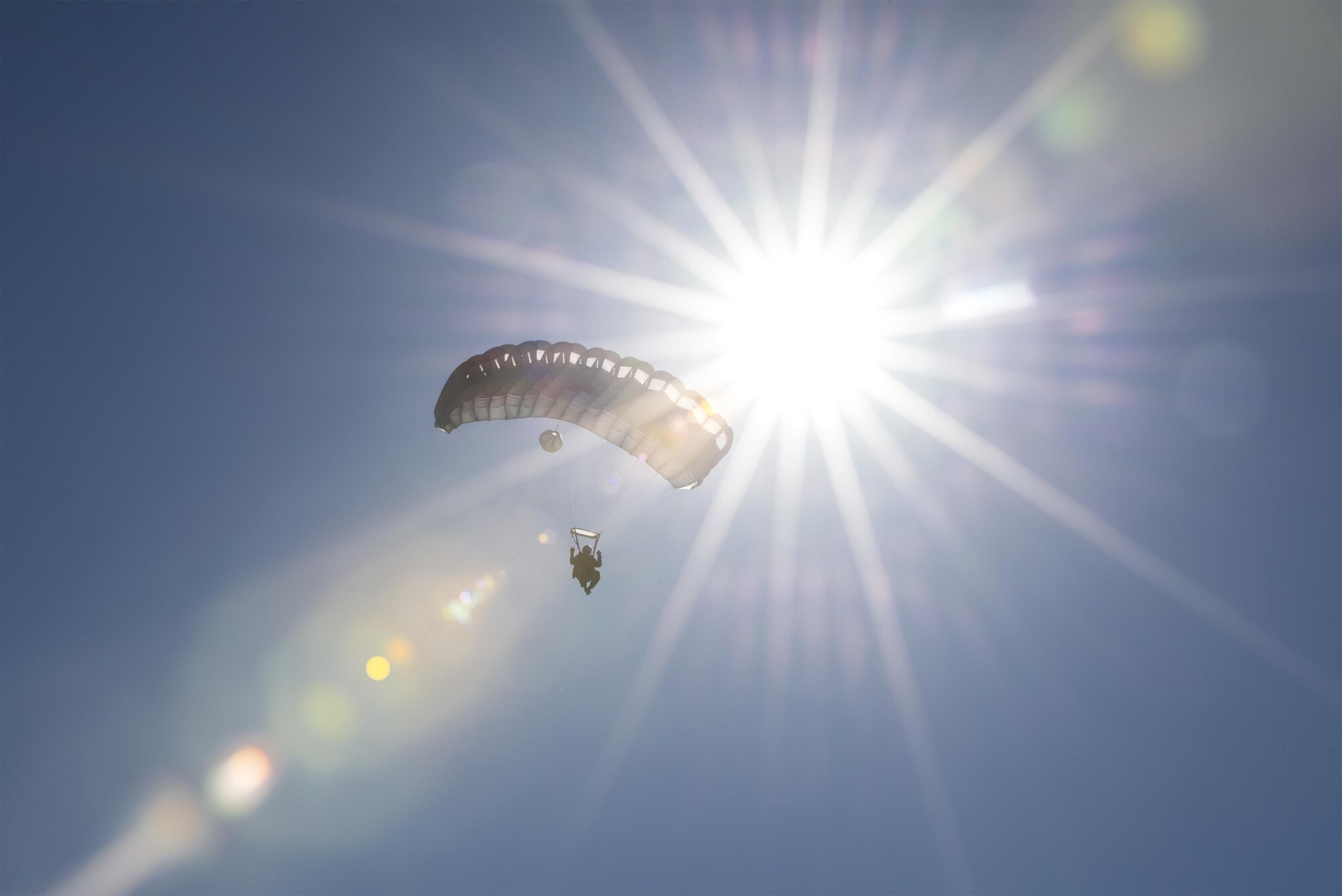 A Pararescuman from the 38th Rescue Squadron floats to the ground during a high-altitude, low-opening jump, Aug. 18, 2016, at Moody Air Force Base, Ga. After jumping from an altitude of nearly 25,000 feet, the Airmen fell for approximately three minutes before opening their parachutes for this training. (U.S. Air Force photo by Airman 1st Class Daniel Snider)
